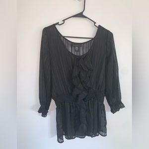 Sheer black top with ruffled front and cinched waist